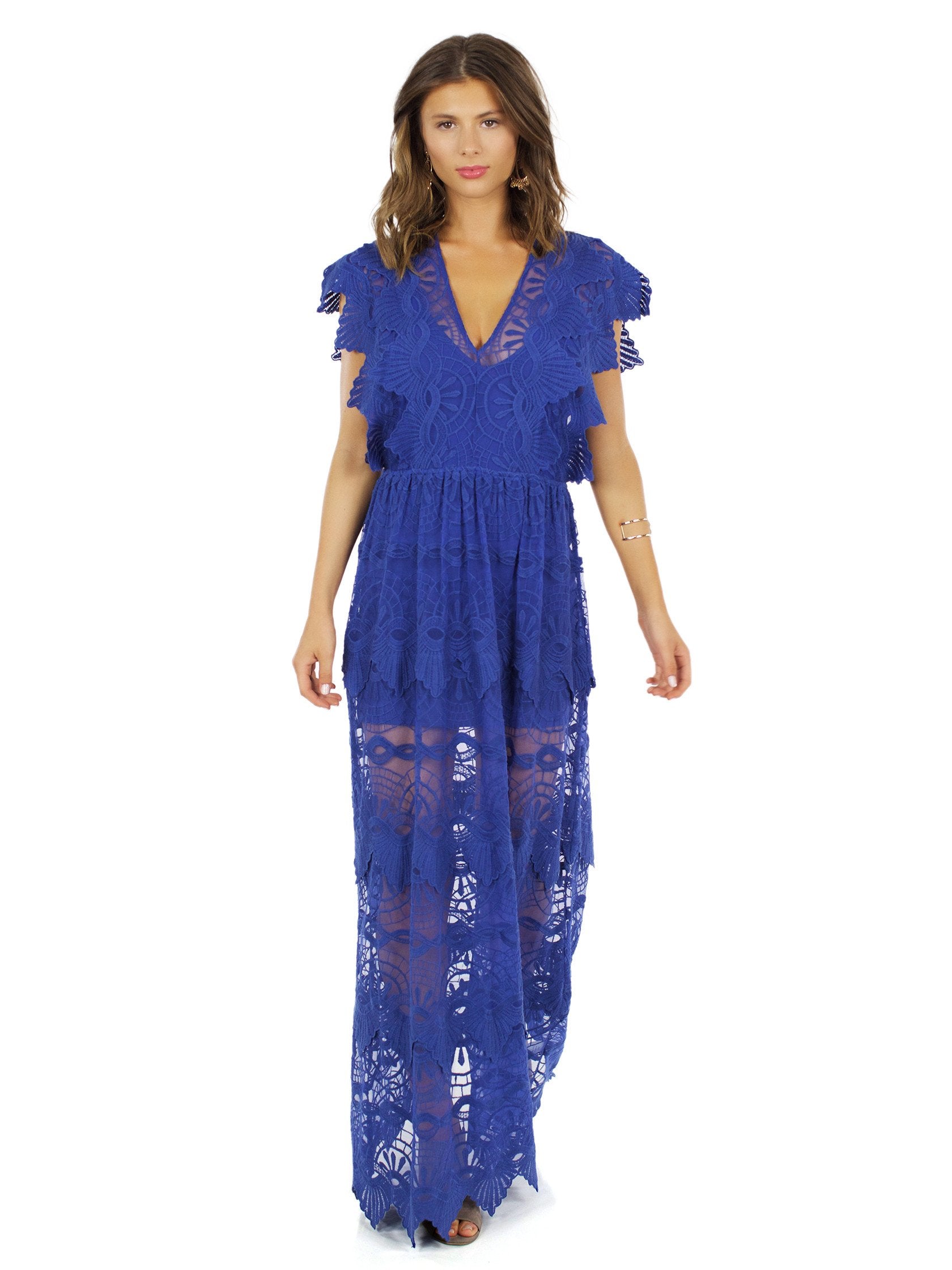 Woman wearing a dress rental from Nightcap Clothing called Mayan Lace Gown
