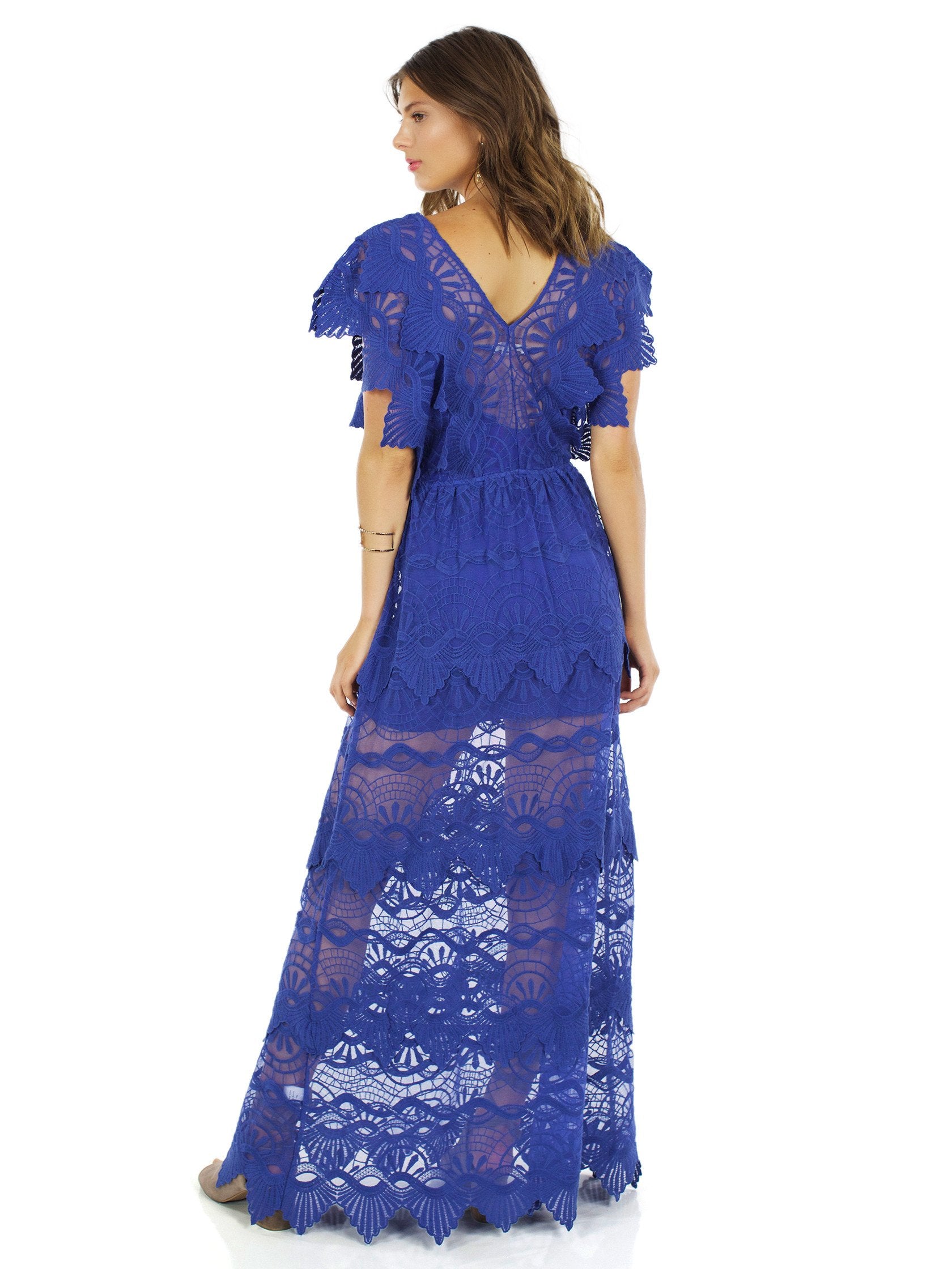 Women wearing a dress rental from Nightcap Clothing called Mayan Lace Gown