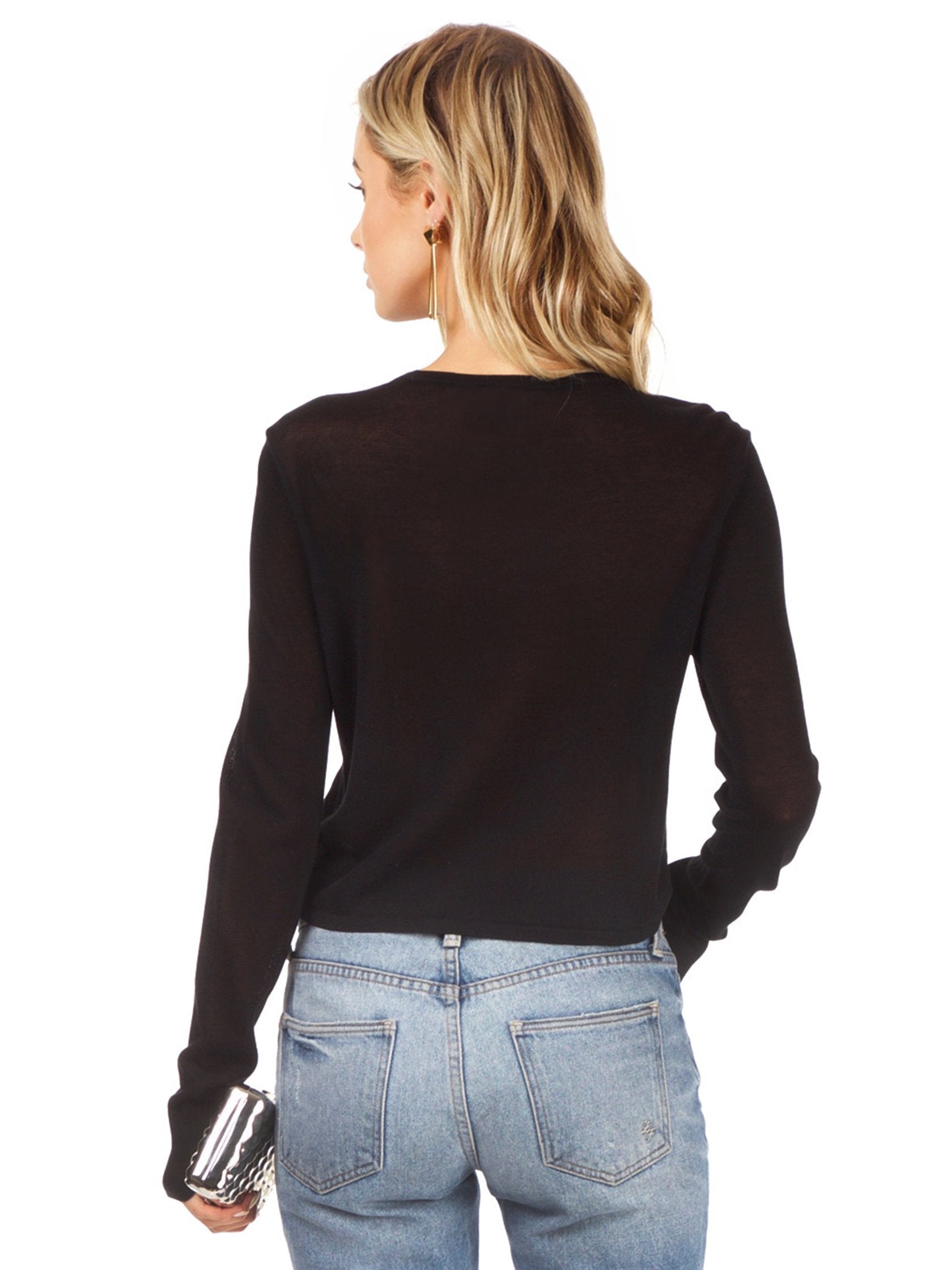Women outfit in a top rental from BCBGMAXAZRIA called Renea Cropped Sweater Top