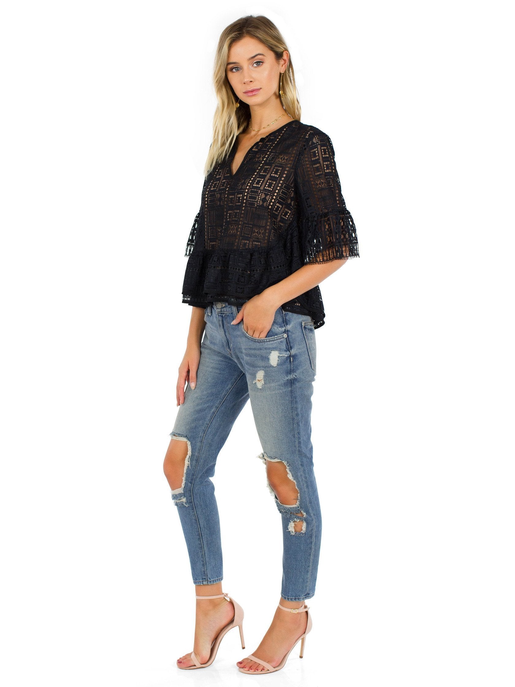 Women wearing a top rental from BCBGMAXAZRIA called Immane Ruffled Lace Top