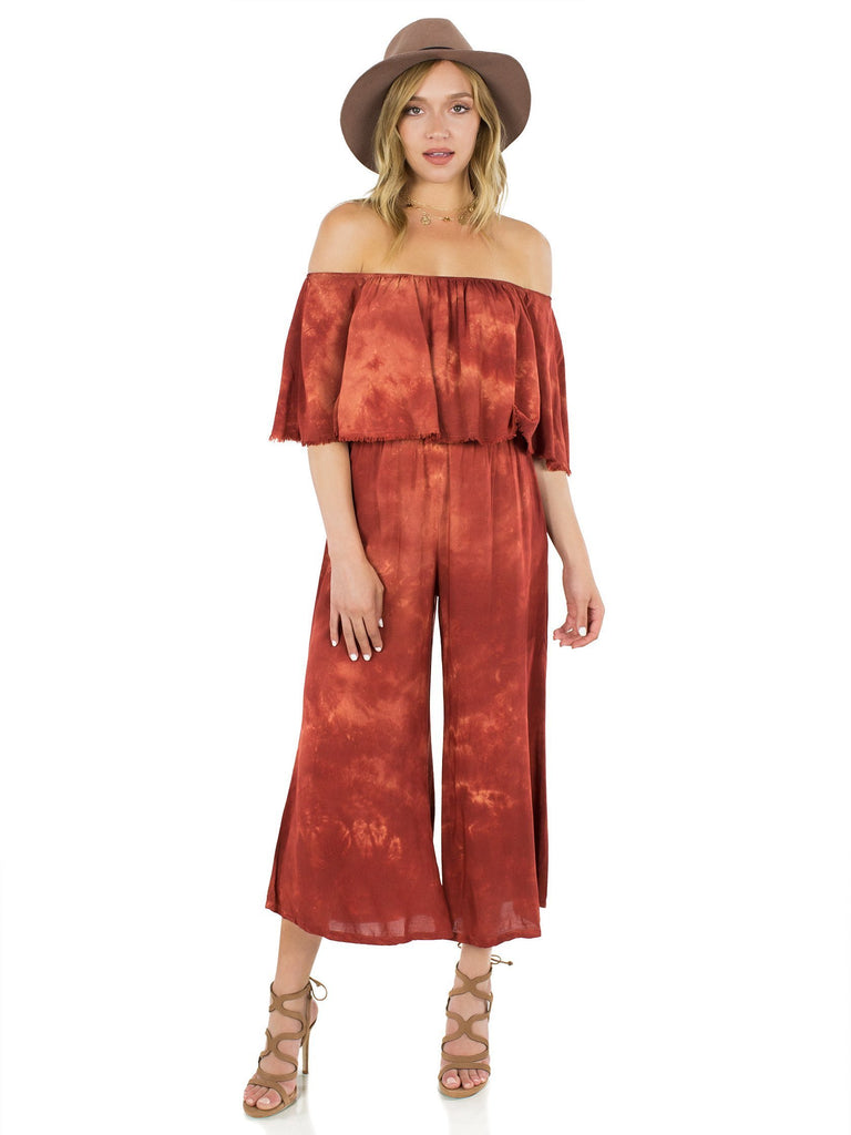 Woman wearing a jumpsuit rental from Blue Life called Festive Off Shoulder Maxi