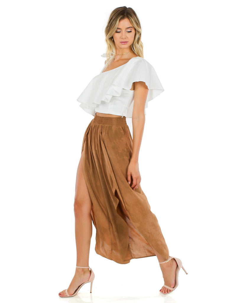 Woman wearing a pants rental from Blue Life called Festive Off Shoulder Maxi