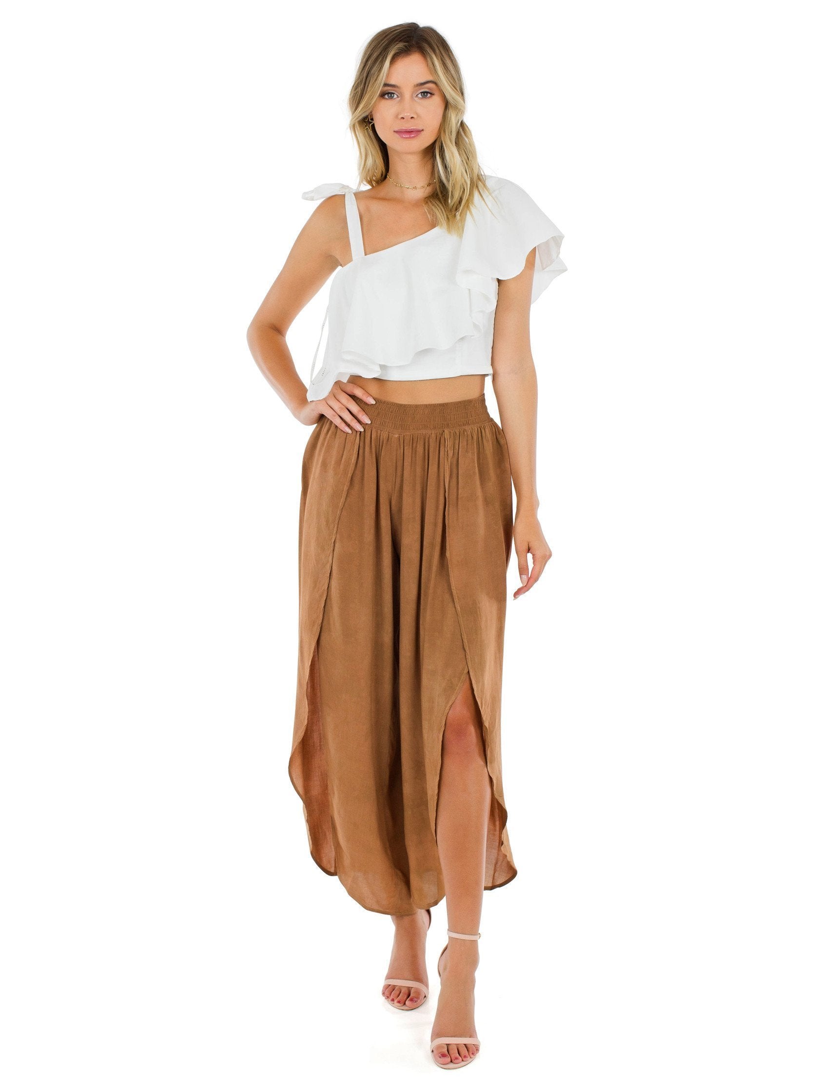 Woman wearing a pants rental from Blue Life called Jeanne Wrap Culotte