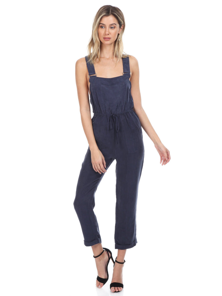 Women wearing a jumpsuit rental from FashionPass called Cadie Overall