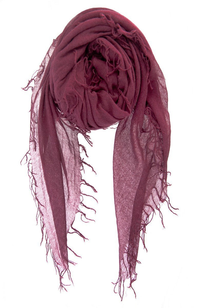 Women wearing a scarf rental from Chan Luu called Fig Cashmere Silk Fringe Scarf