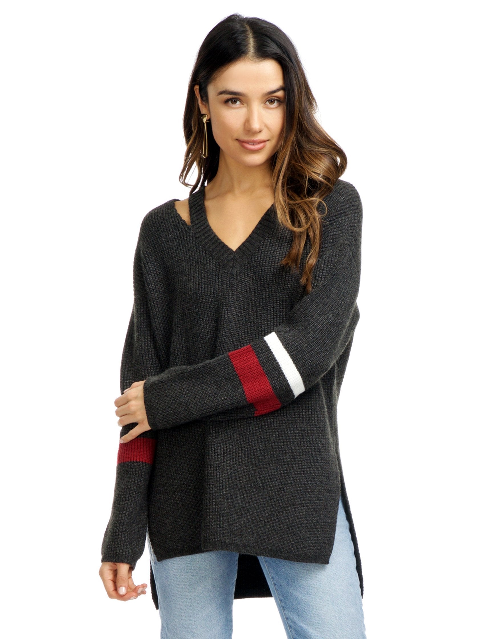 Woman wearing a sweater rental from Strut & Bolt called Cutout Stripe Sweater