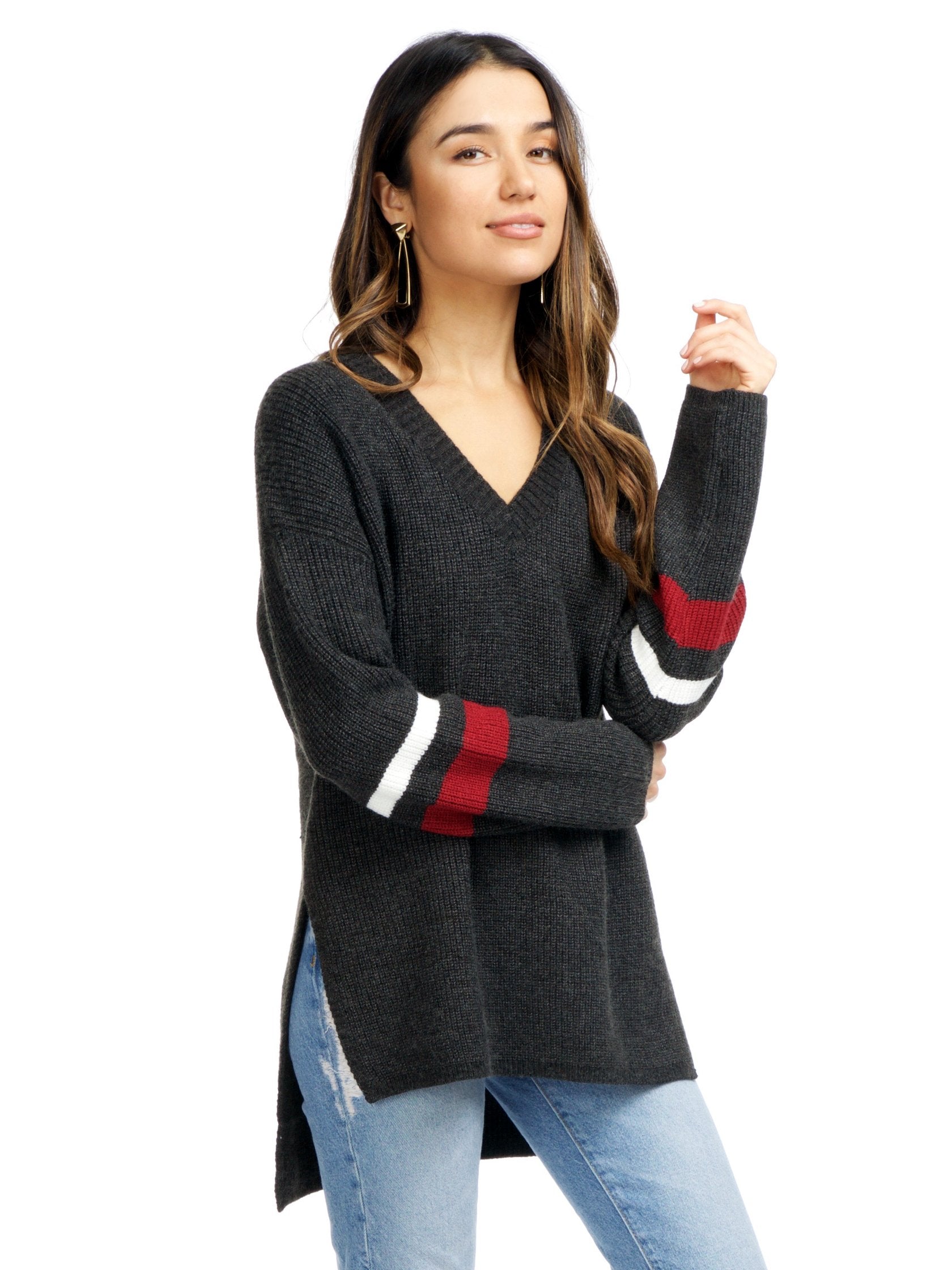 Women wearing a sweater rental from Strut & Bolt called Cutout Stripe Sweater
