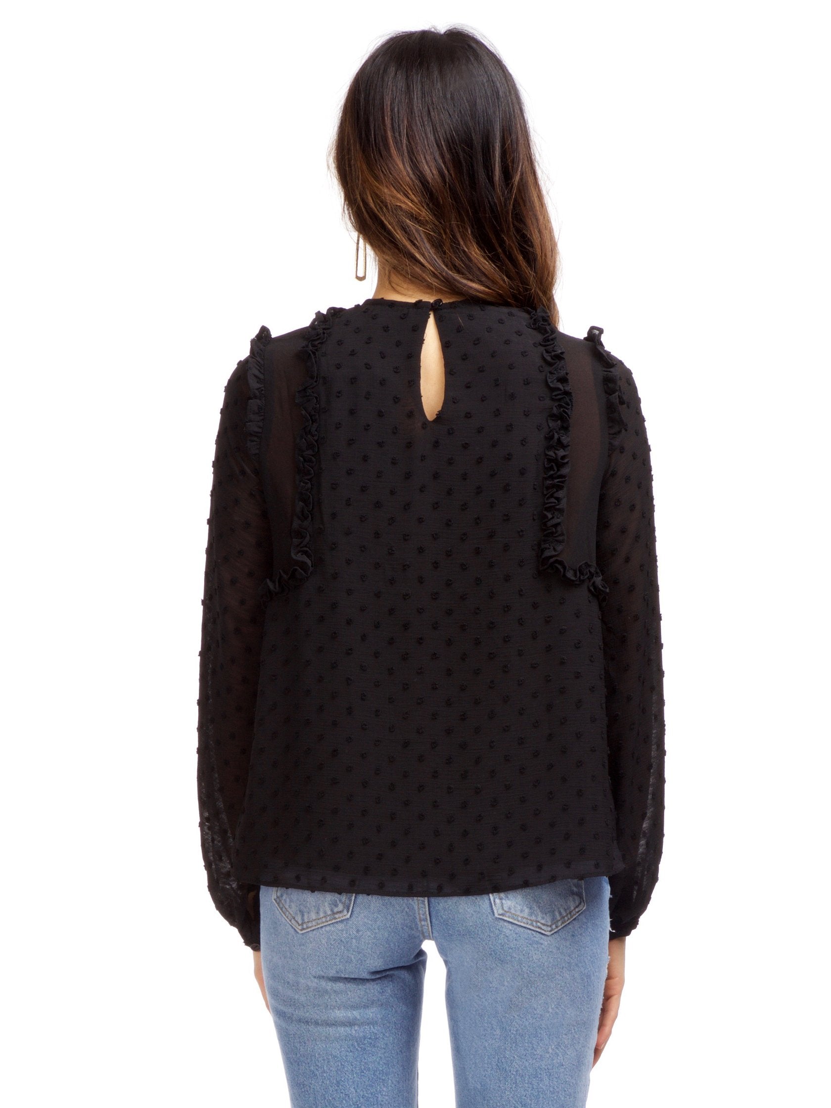 Women outfit in a top rental from Strut & Bolt called Dotted Ruffle Long Sleeve Top