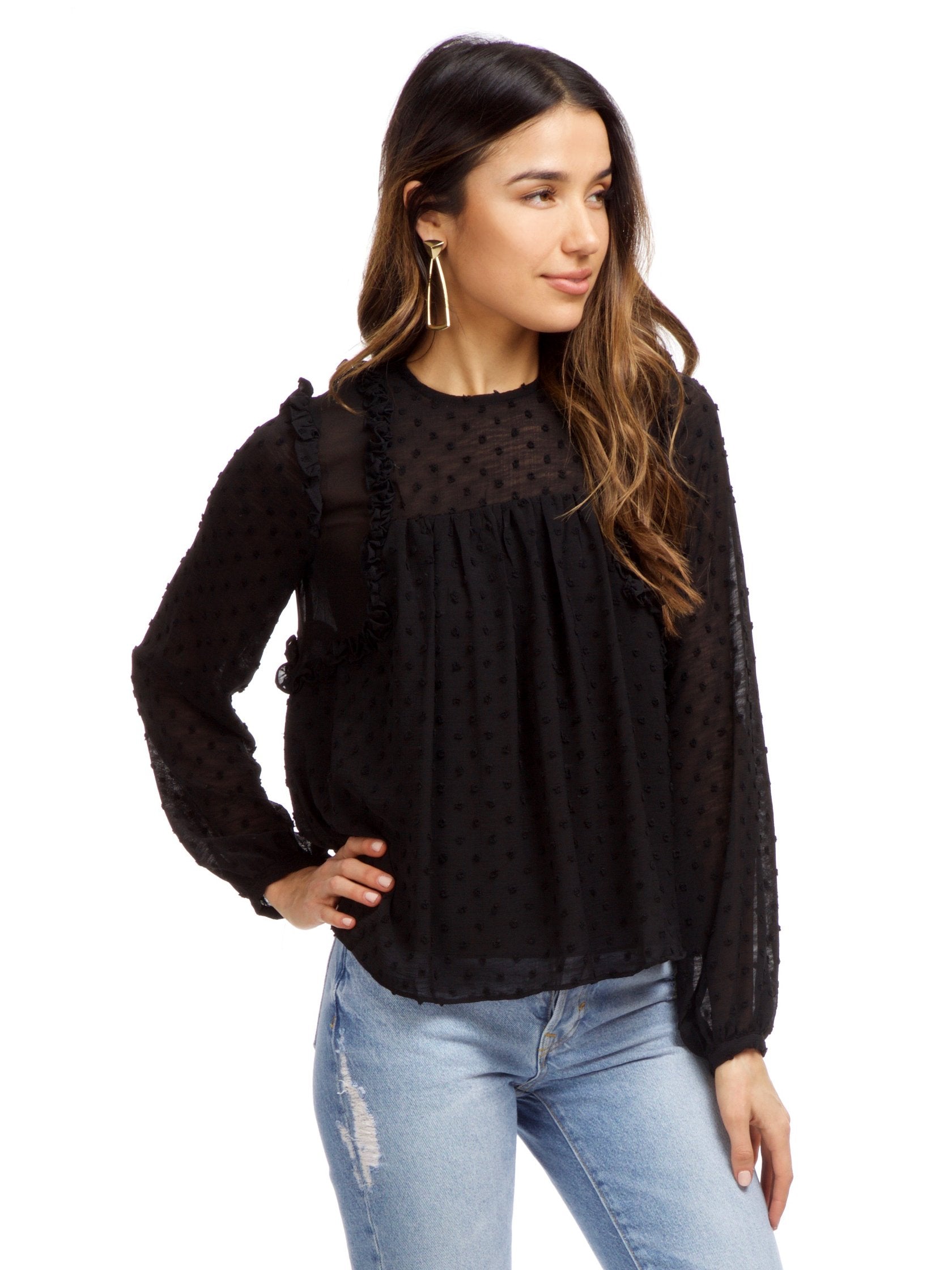 Women wearing a top rental from Strut & Bolt called Dotted Ruffle Long Sleeve Top