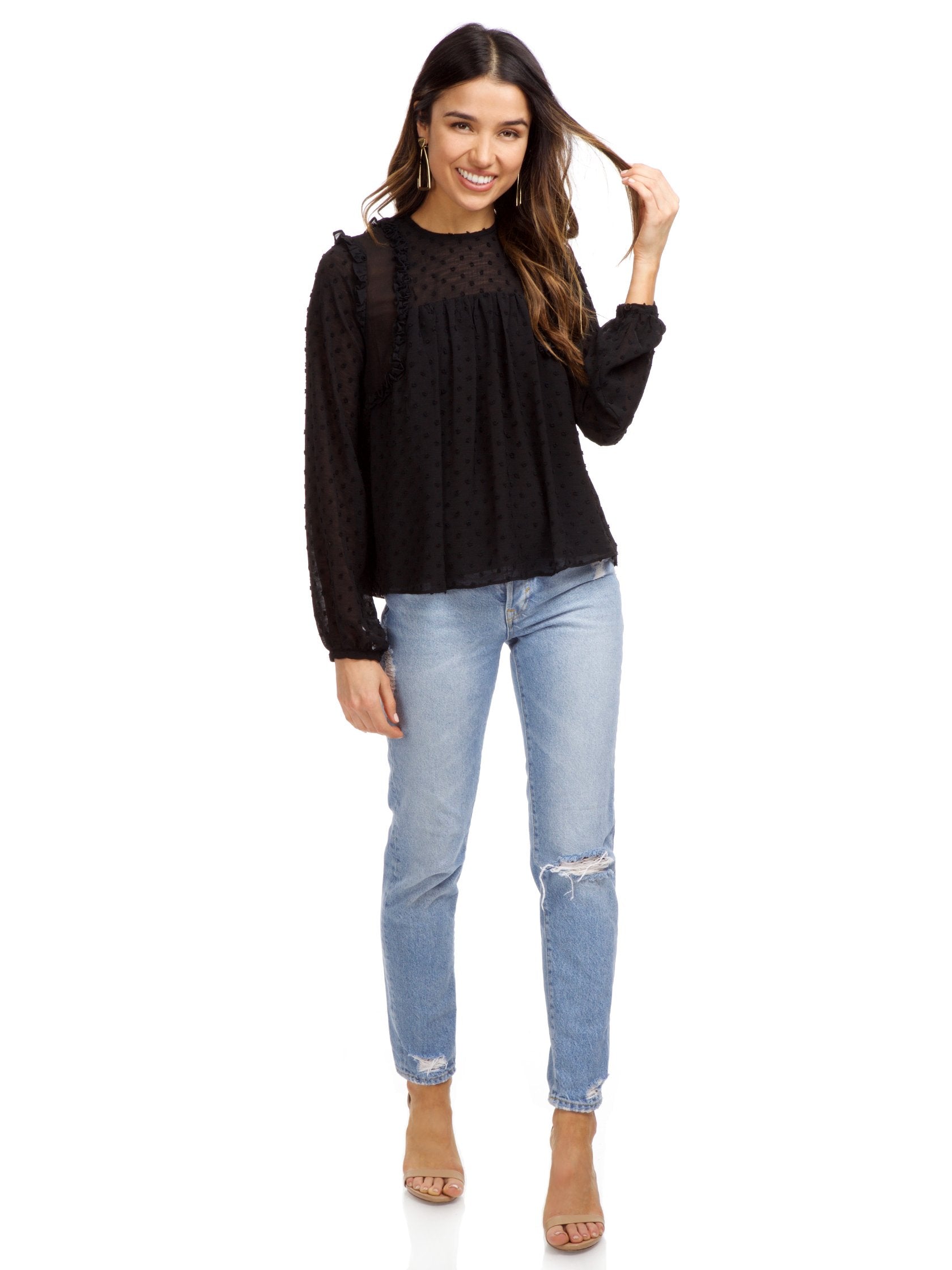 Girl wearing a top rental from Strut & Bolt called Dotted Ruffle Long Sleeve Top