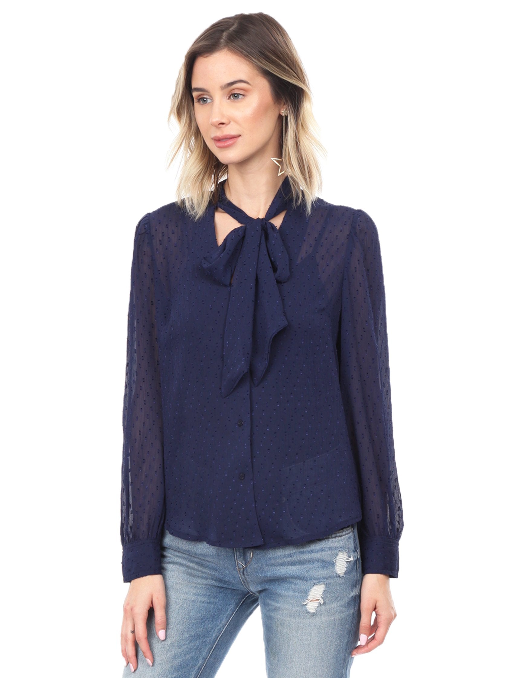 Woman wearing a top rental from FashionPass called Dottie Long Sleeve Blouse