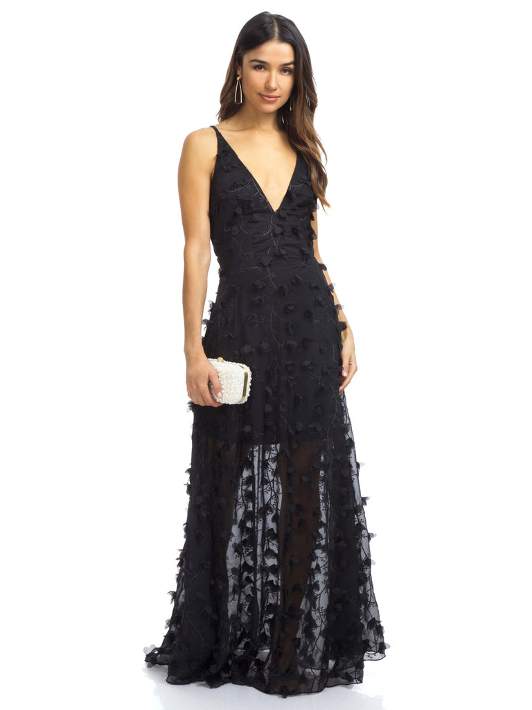 Woman wearing a dress rental from Dress the Population called Blair Sequin Lace Midi