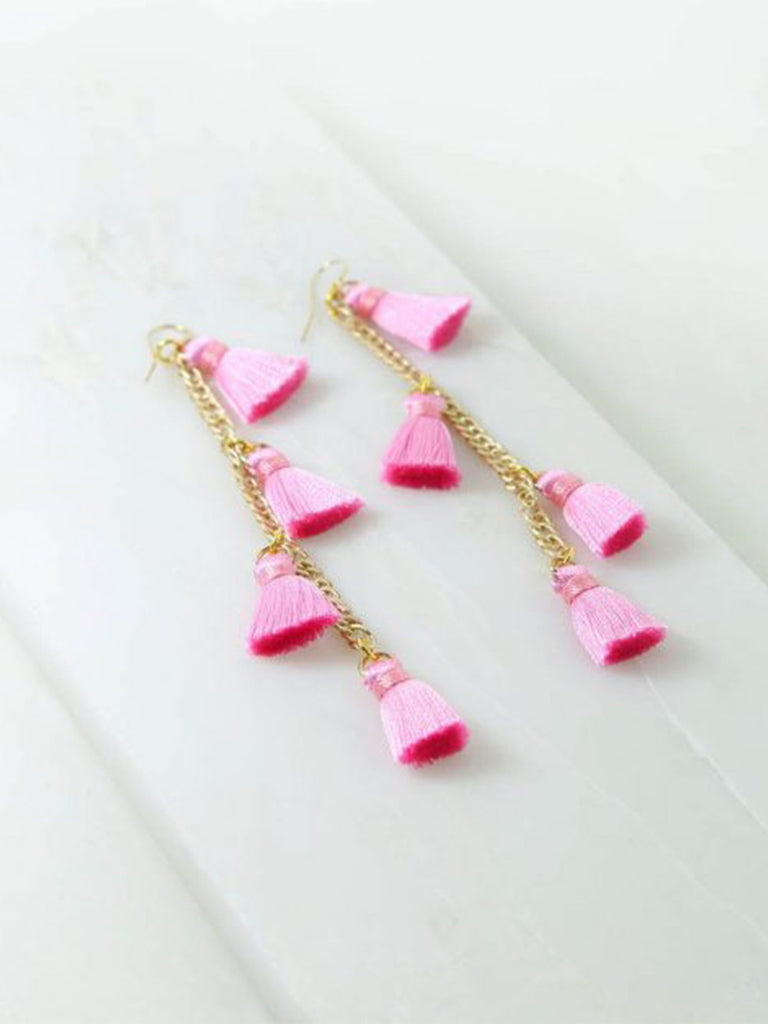 Women outfit in a earrings rental from Vanessa Mooney called Astrid Knotted Tassel Earring