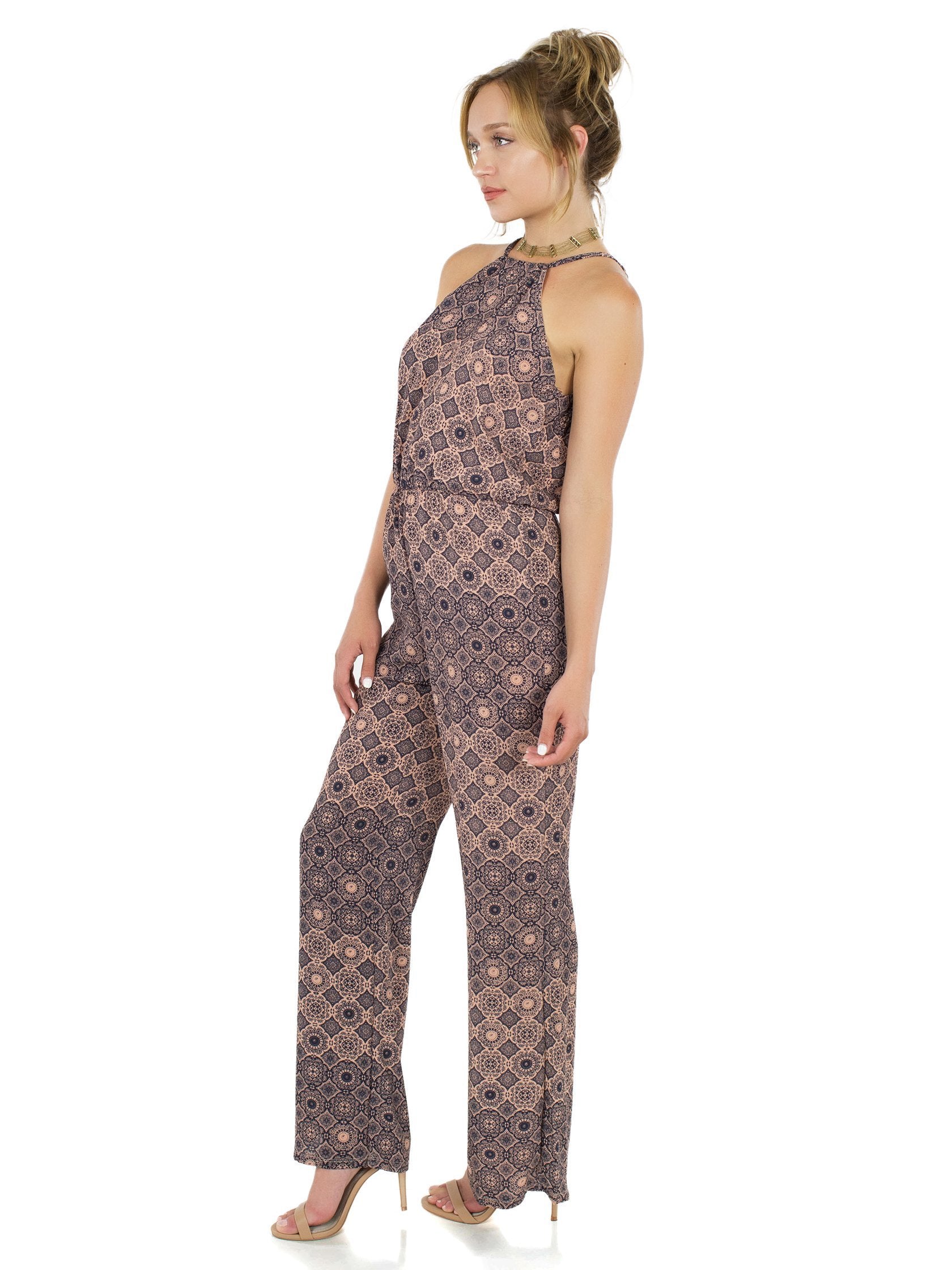 Woman wearing a jumpsuit rental from FashionPass called Desert Sky Jumpsuit