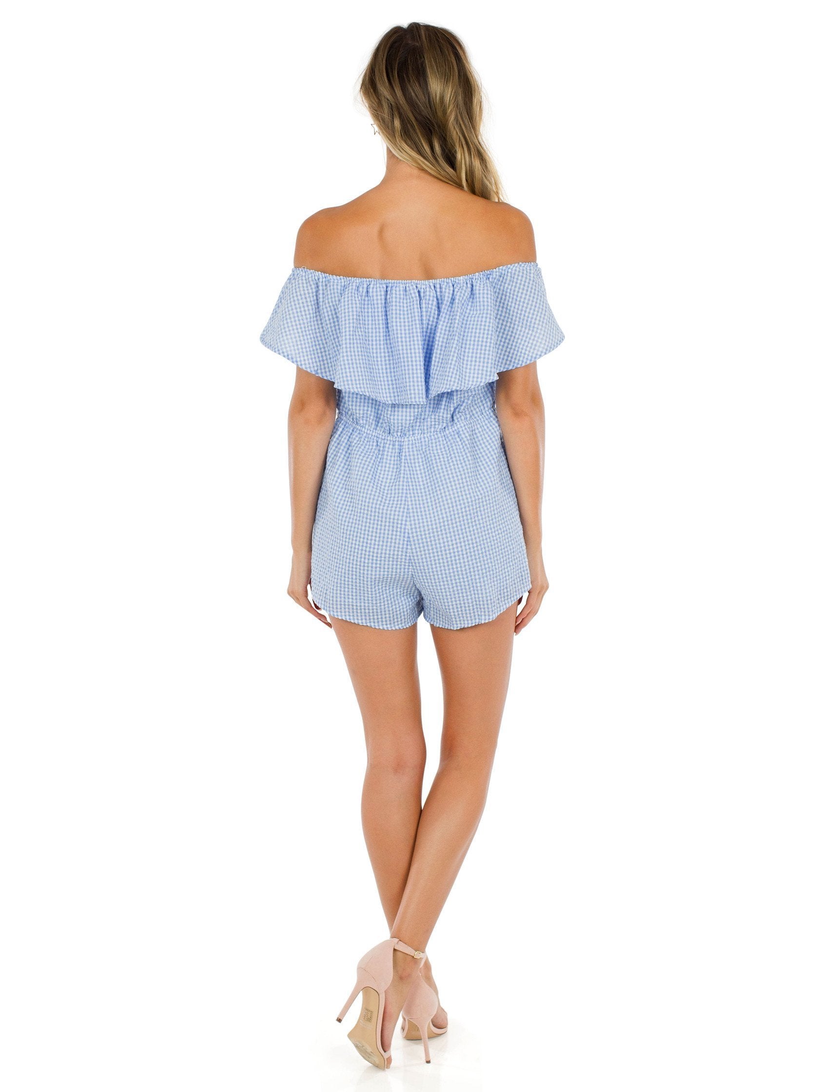 Women wearing a romper rental from FashionPass called Going Gingham Romper