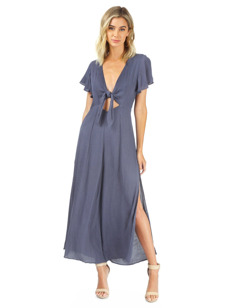 Women wearing a jumpsuit rental from FashionPass called Tie Front Long Sleeve Romper