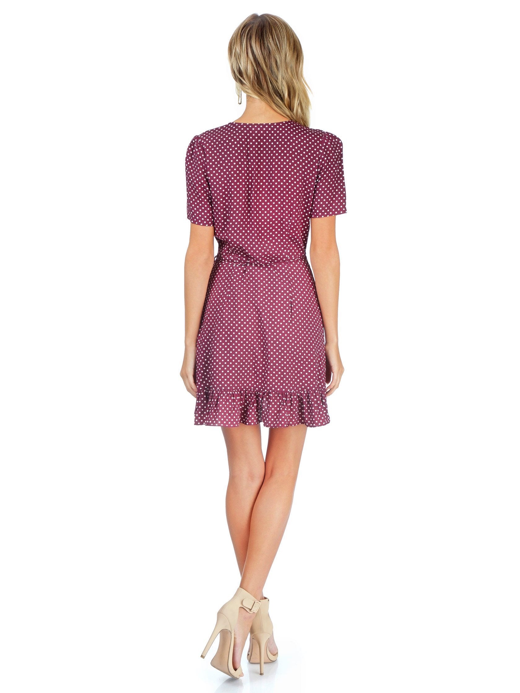 Girl wearing a dress rental from FashionPass called Kat Mini Dress