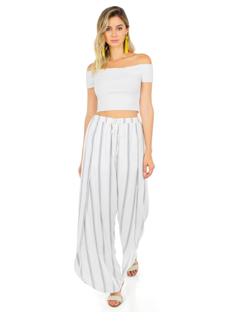 Woman wearing a pants rental from FashionPass called Everleigh Crop Top