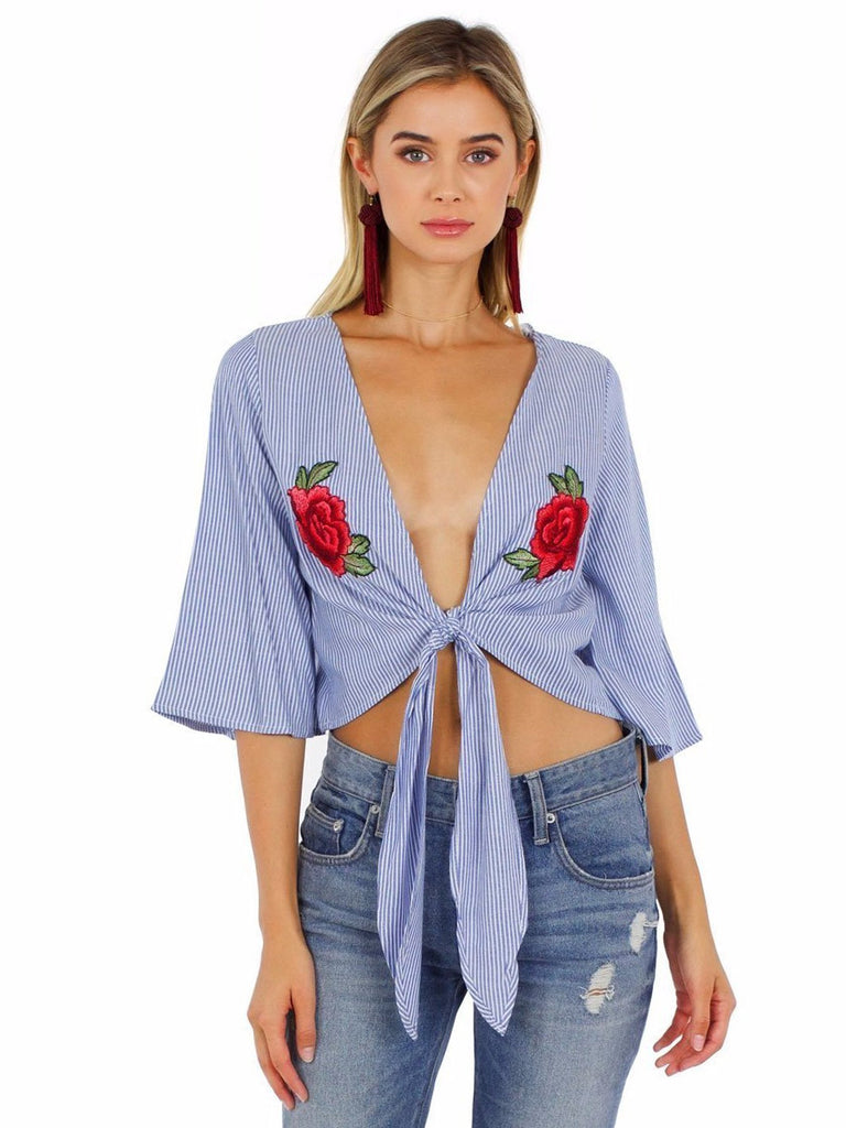 Woman wearing a top rental from FashionPass called Bowie Ruffle Tie Top