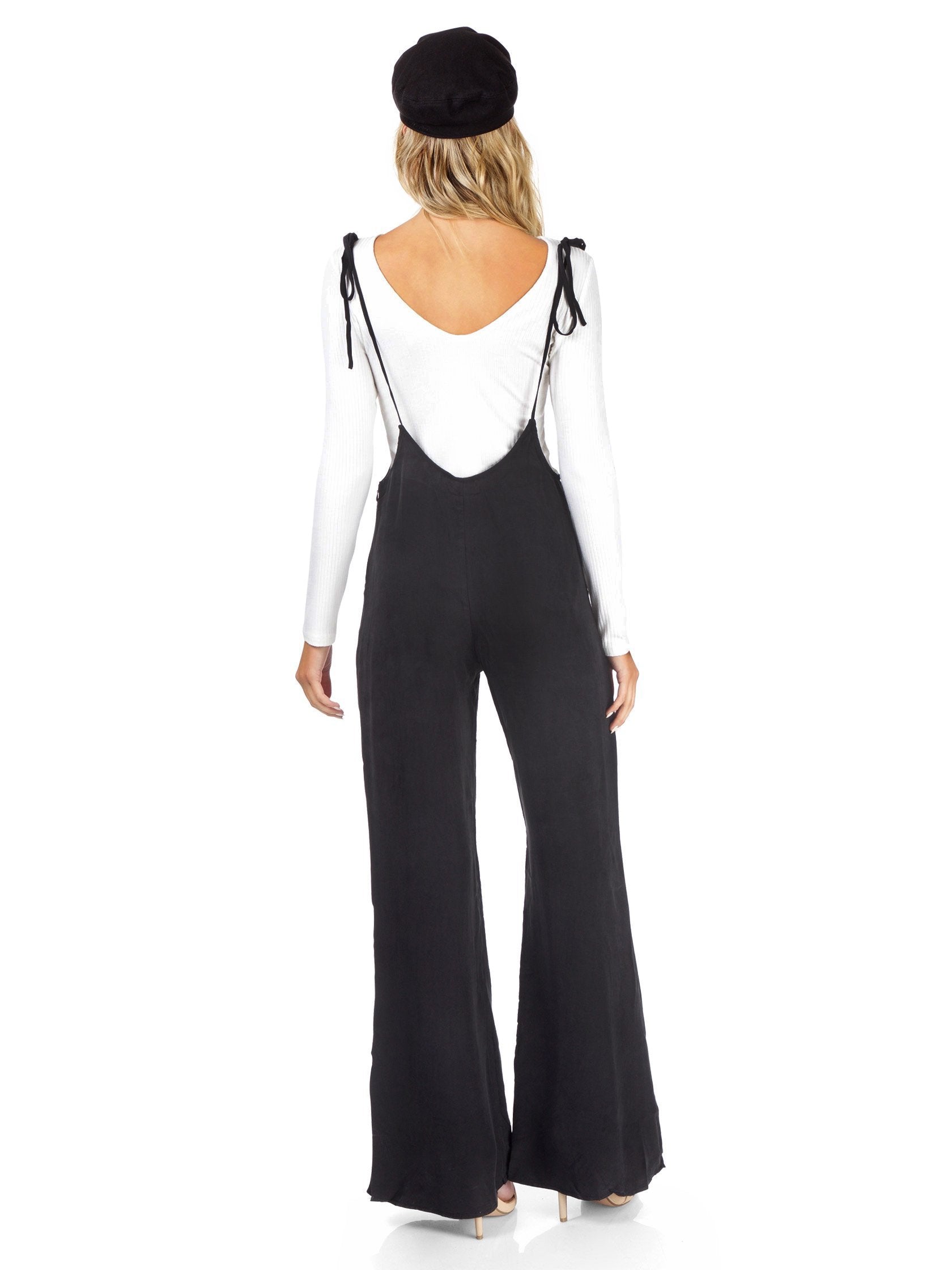 Women wearing a jumpsuit rental from FashionPass called Sasha Jumpsuit