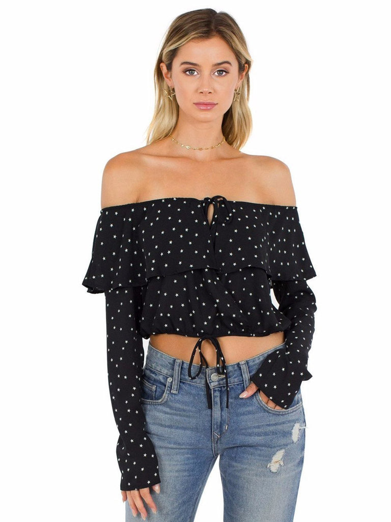 Woman wearing a top rental from FashionPass called Harmony Cold Shoulder Sweater