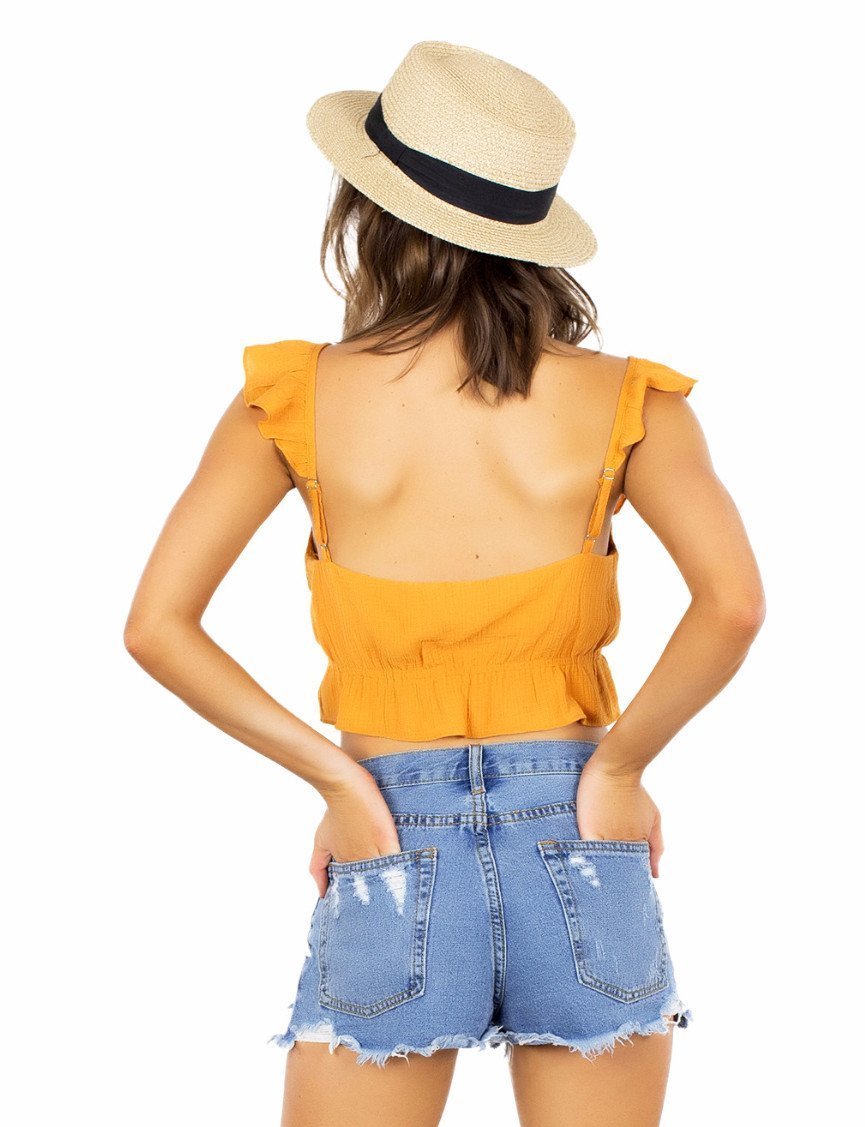 Women outfit in a top rental from FashionPass called Sunrise Crop Top