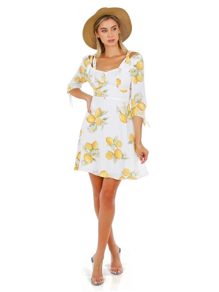 Girl wearing a dress rental from For Love & Lemons called Odean Dress