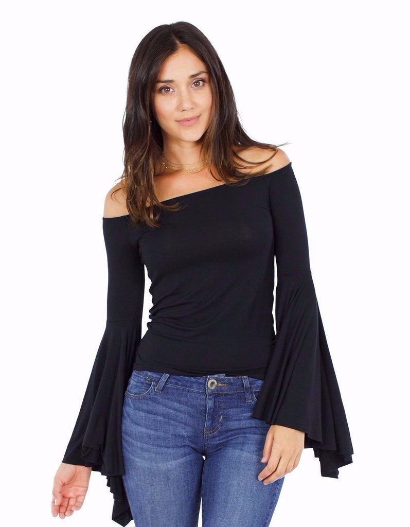 Woman wearing a top rental from Free People called Cross Shoulder Top