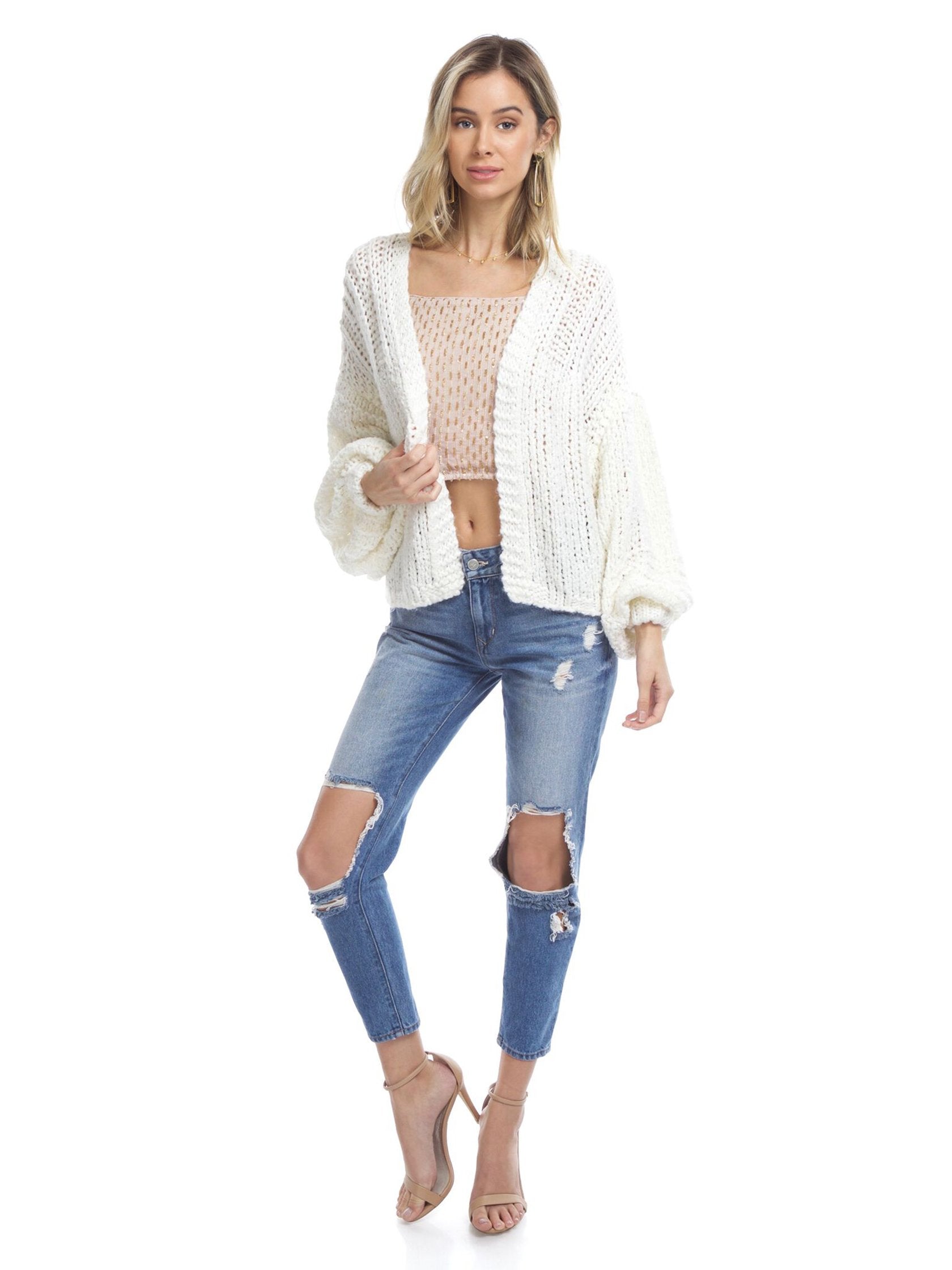 Girl wearing a cardigan rental from Free People called Chamomile Cardi