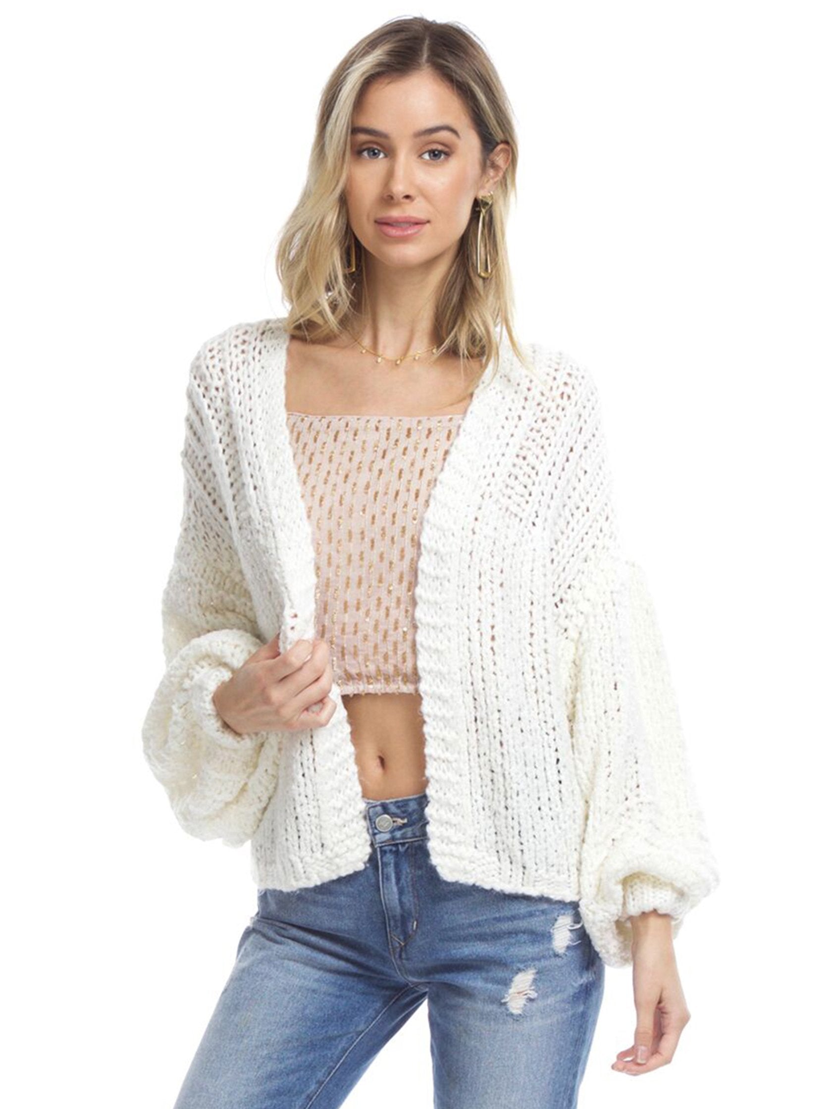 Woman wearing a cardigan rental from Free People called Chamomile Cardi