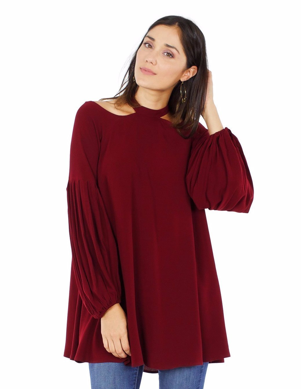 Women wearing a top rental from Free People called Drift Away Cold Shoulder Tunic