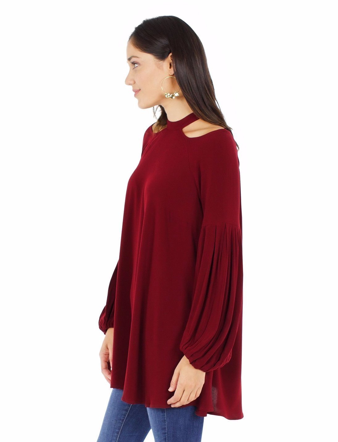 Women outfit in a top rental from Free People called Drift Away Cold Shoulder Tunic