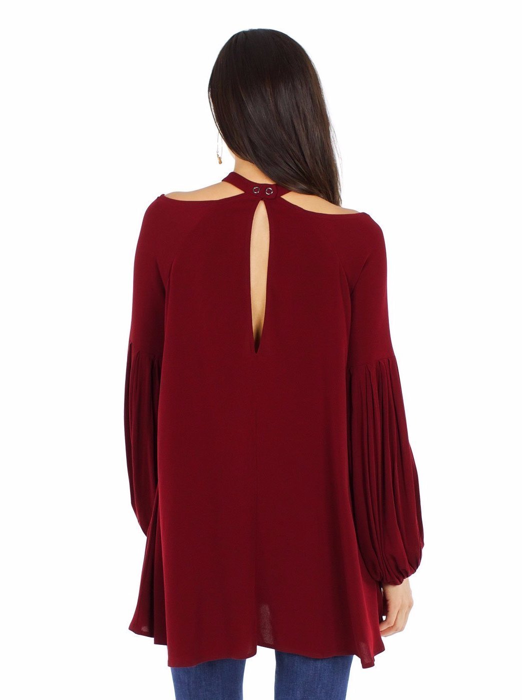Girl wearing a top rental from Free People called Drift Away Cold Shoulder Tunic
