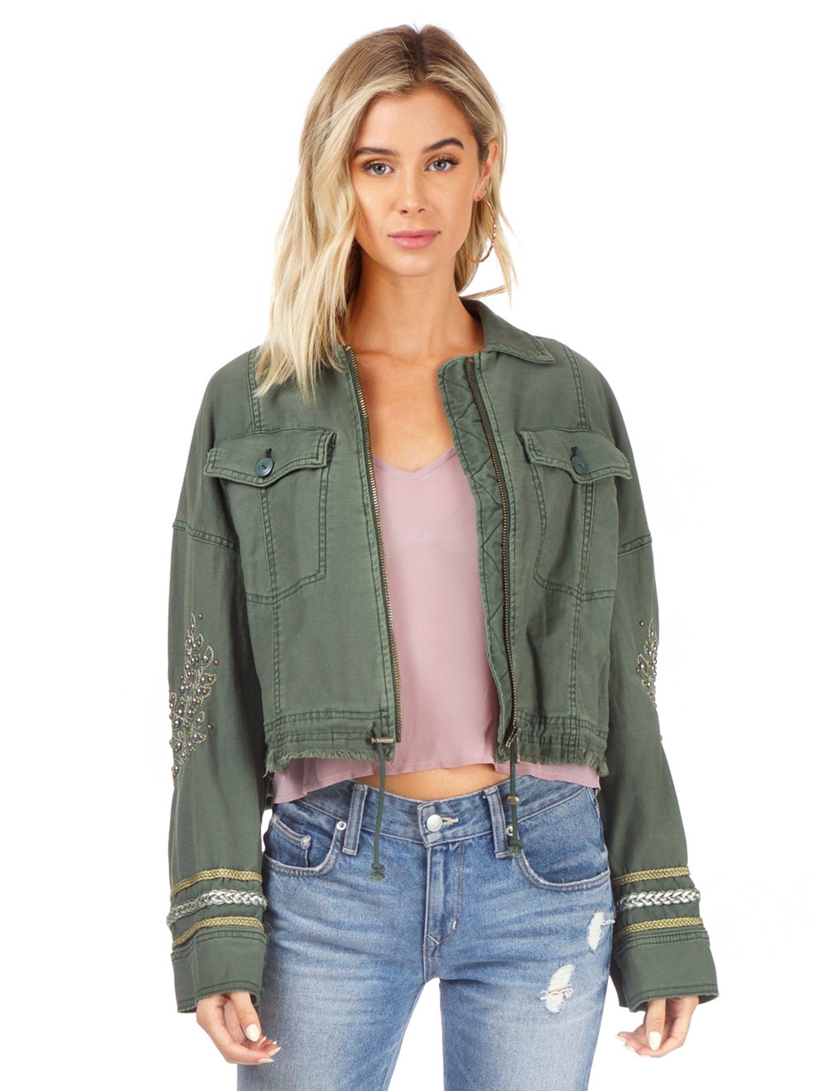 Woman wearing a jacket rental from Free People called Extreme Cropped Military Jacket