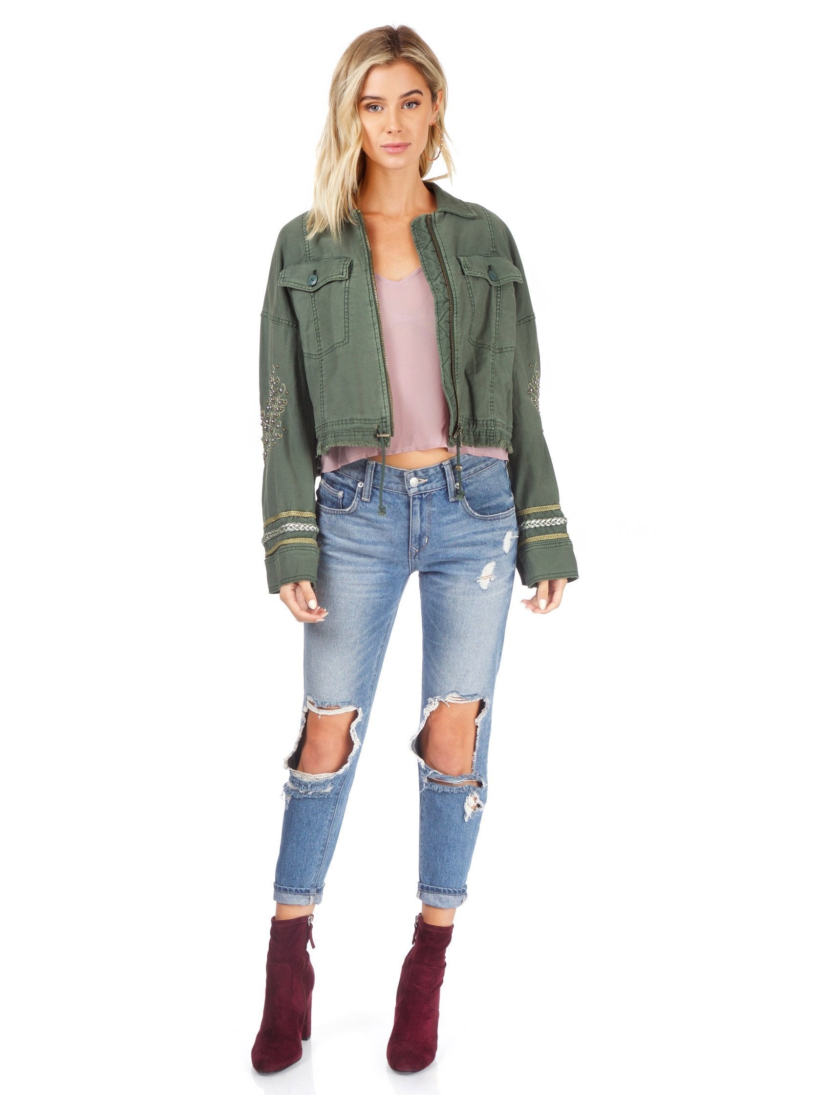 Girl wearing a jacket rental from Free People called Extreme Cropped Military Jacket