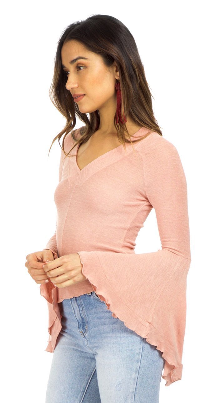 Women wearing a top rental from Free People called Soo Dramatic Long Sleeve Top