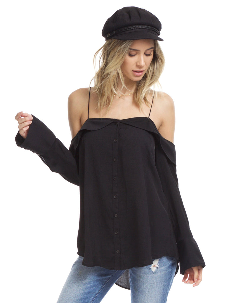 Woman wearing a top rental from Free People called Black Marble Cami