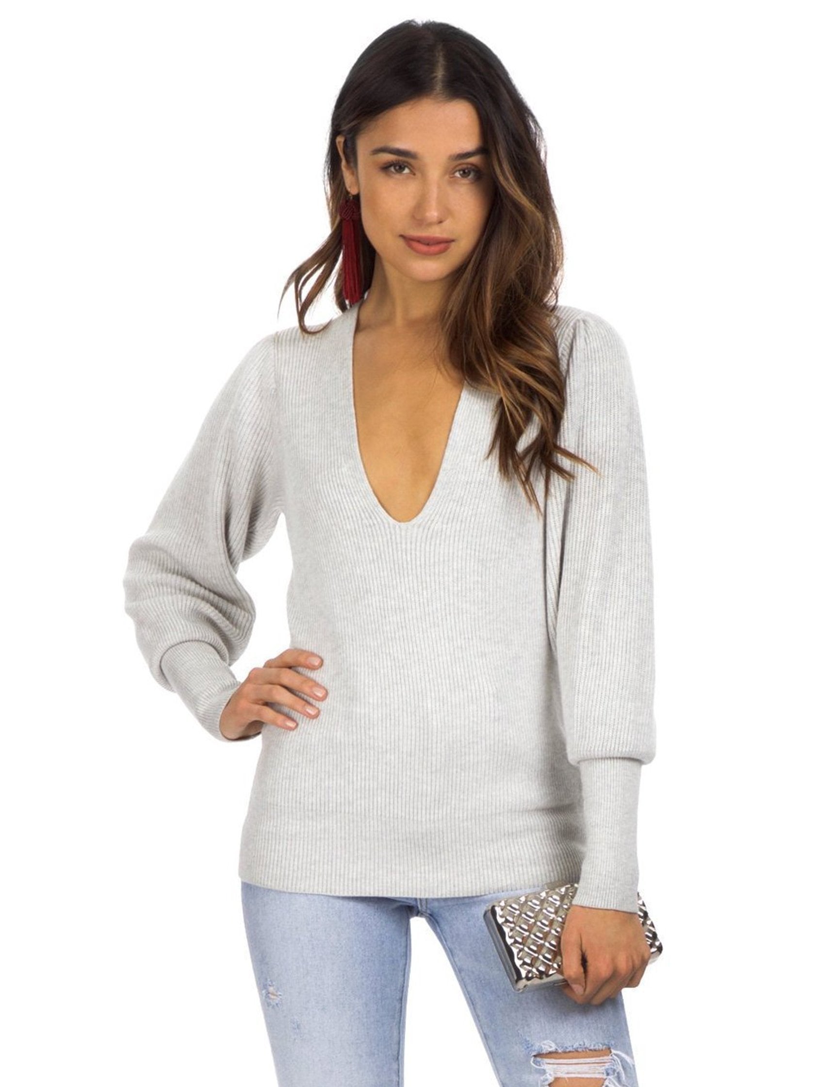 Woman wearing a sweater rental from Free People called Gingersnap Tunic