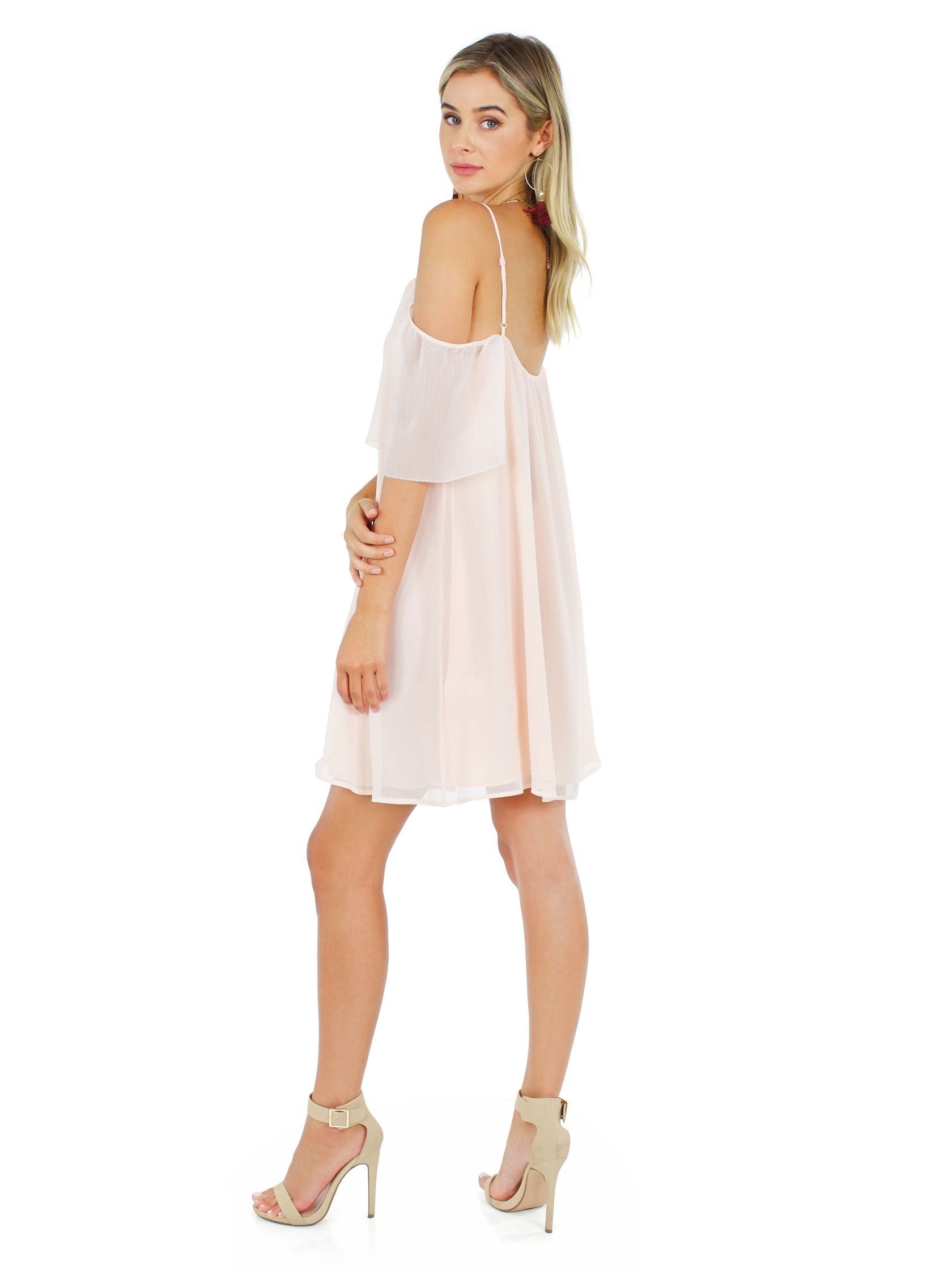 Woman wearing a dress rental from French Connection called Constance Drape Cold Shoulder Dress