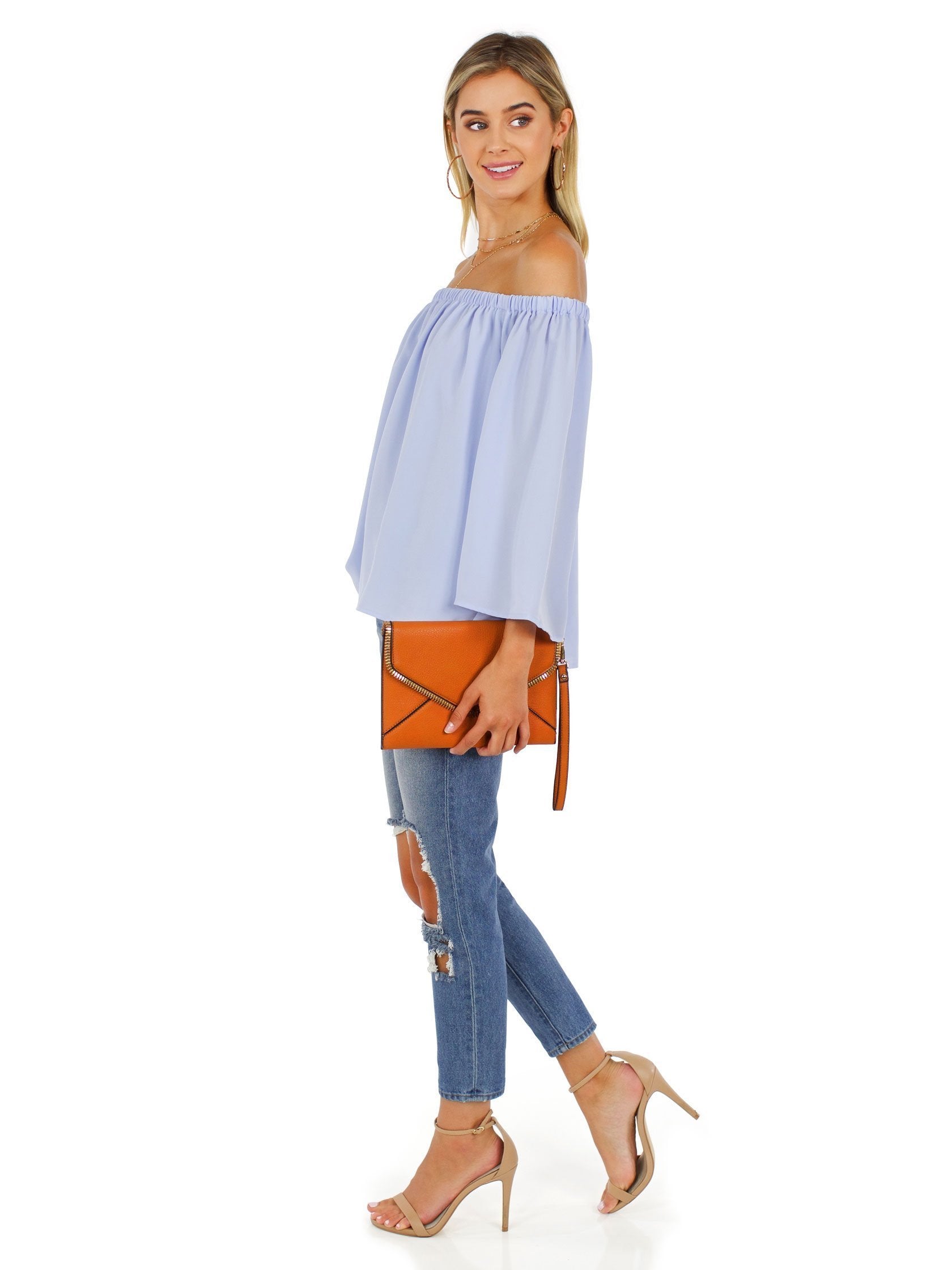 Woman wearing a top rental from French Connection called Off Shoulder Top
