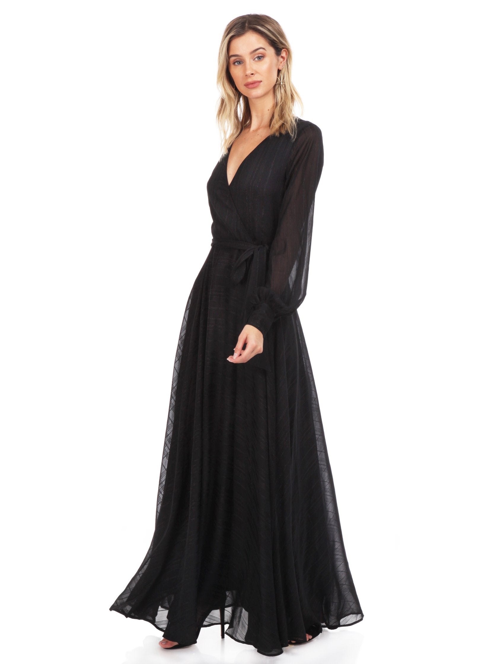 Woman wearing a dress rental from YUMI KIM called Giselle Maxi Dress