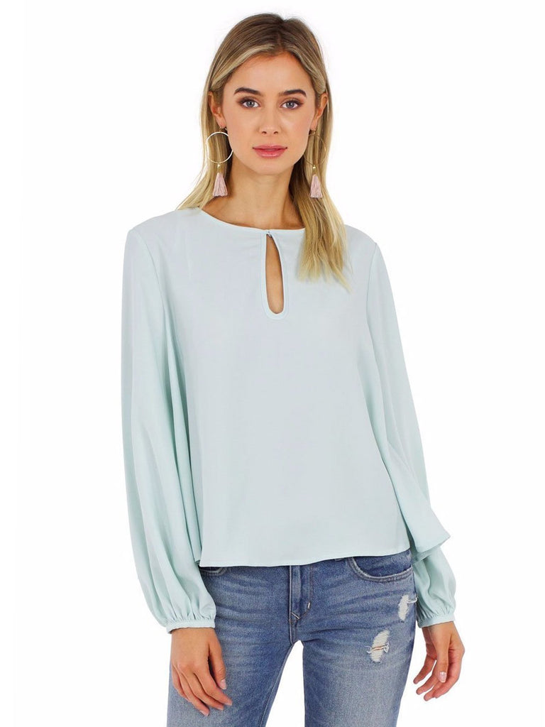 Girl wearing a top rental from Grace Willow called Cold Shoulder Blouson Sleeve Blouse