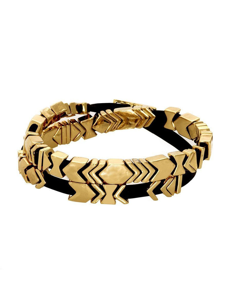 Woman wearing a bracelet rental from House of Harlow 1960 called Sedona Selfie Cuff Onyx And Gold