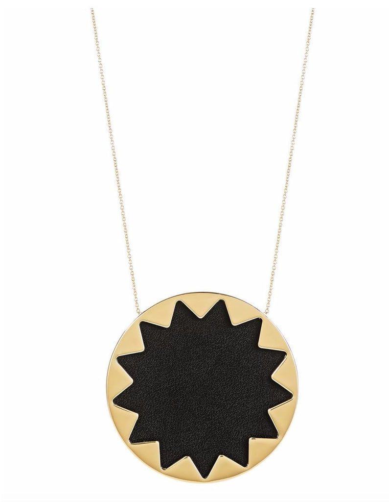 Women wearing a necklace rental from House of Harlow 1960 called Gold Scutum Double Pendant Necklace