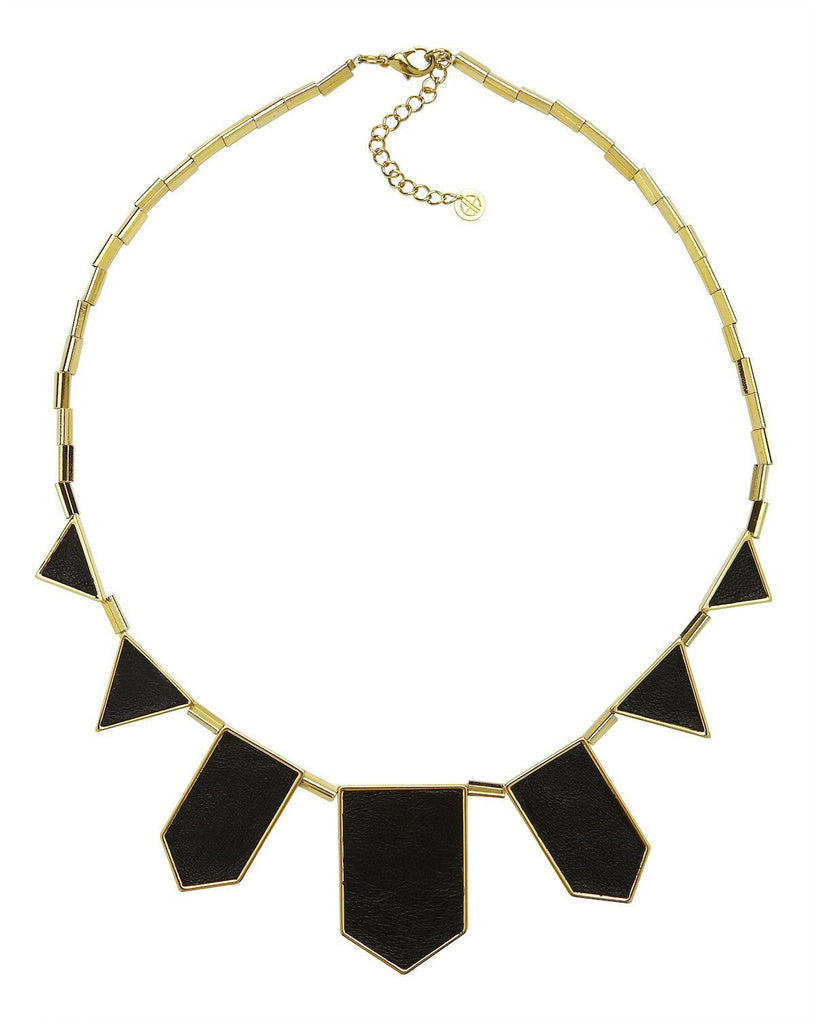 Woman wearing a necklace rental from House of Harlow 1960 called Classic Station Pyramid Necklace