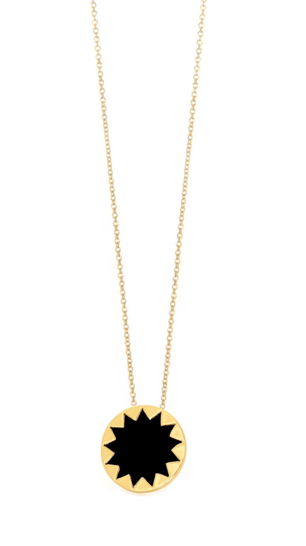 Girl wearing a necklace rental from House of Harlow 1960 called Mini Sunburst Pendant Necklace