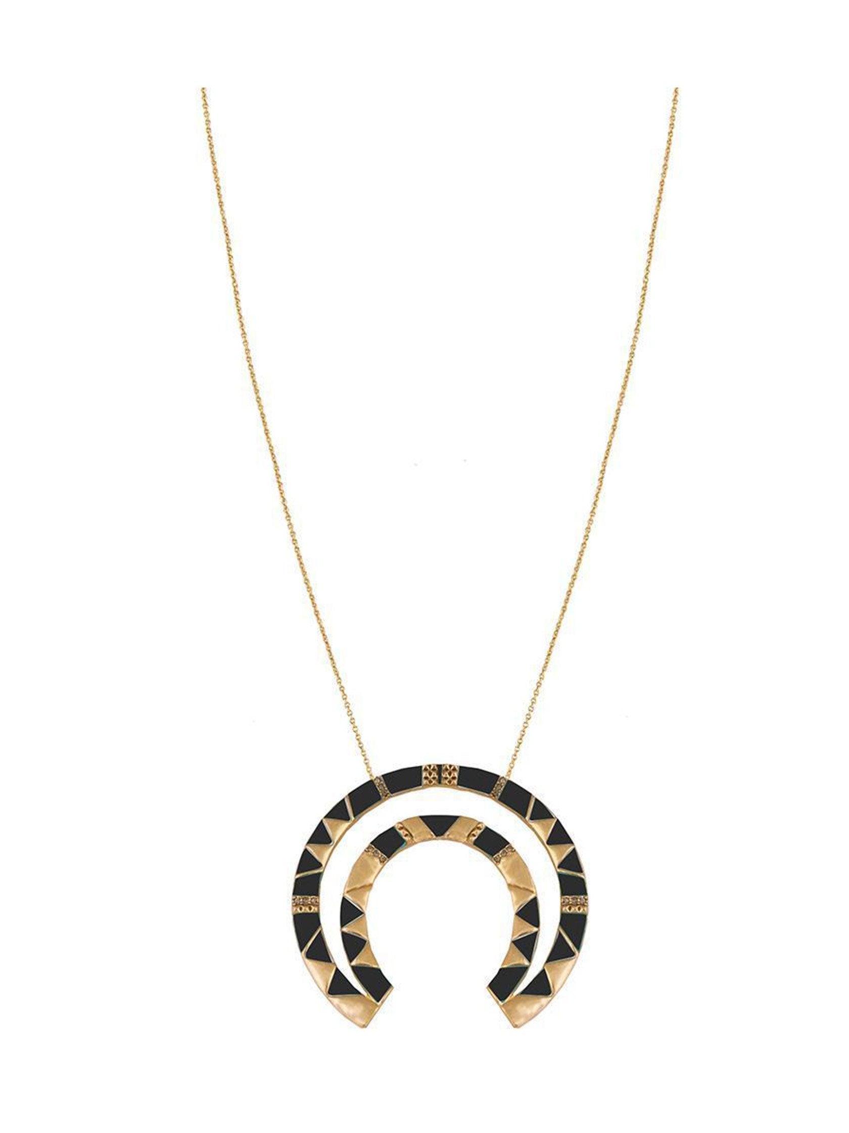 Girl wearing a necklace rental from House of Harlow 1960 called House Of Harlow Curve Aztec Pendant Necklace