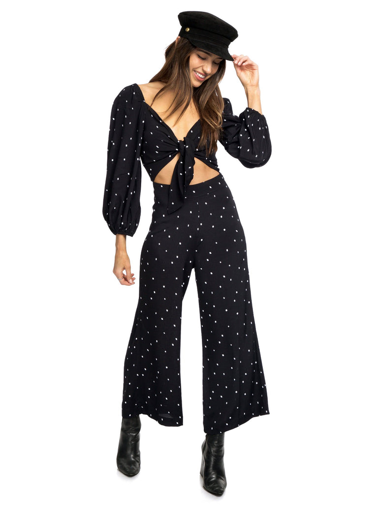 Woman wearing a jumpsuit rental from Blue Life called Crystal Pleated Kimono Tie Front Top