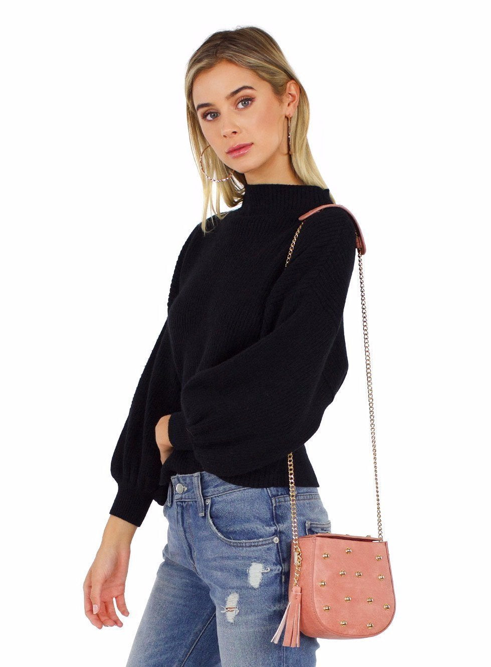 Woman wearing a top rental from Line & Dot called Balloon Sleeve Pullover Sweater