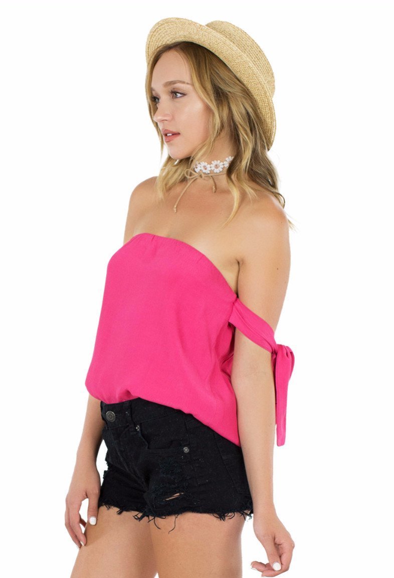 Women wearing a top rental from Lucca Couture called Guava Off Shoulder Tie Sleeve Top